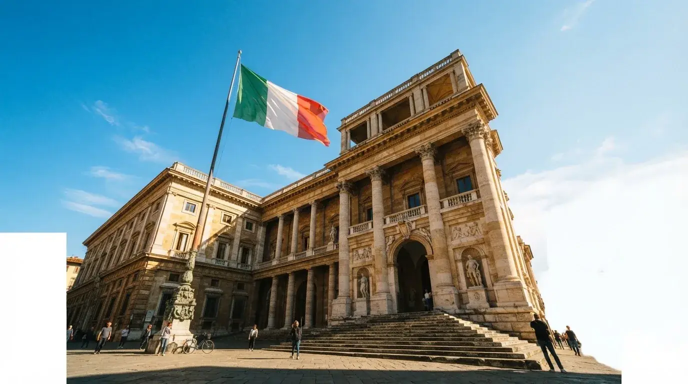 Un edificio governativo italiano con bandiera al vento fotografato dal basso in una giornata di sole.